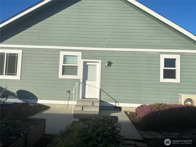 a view of a backyard of the house