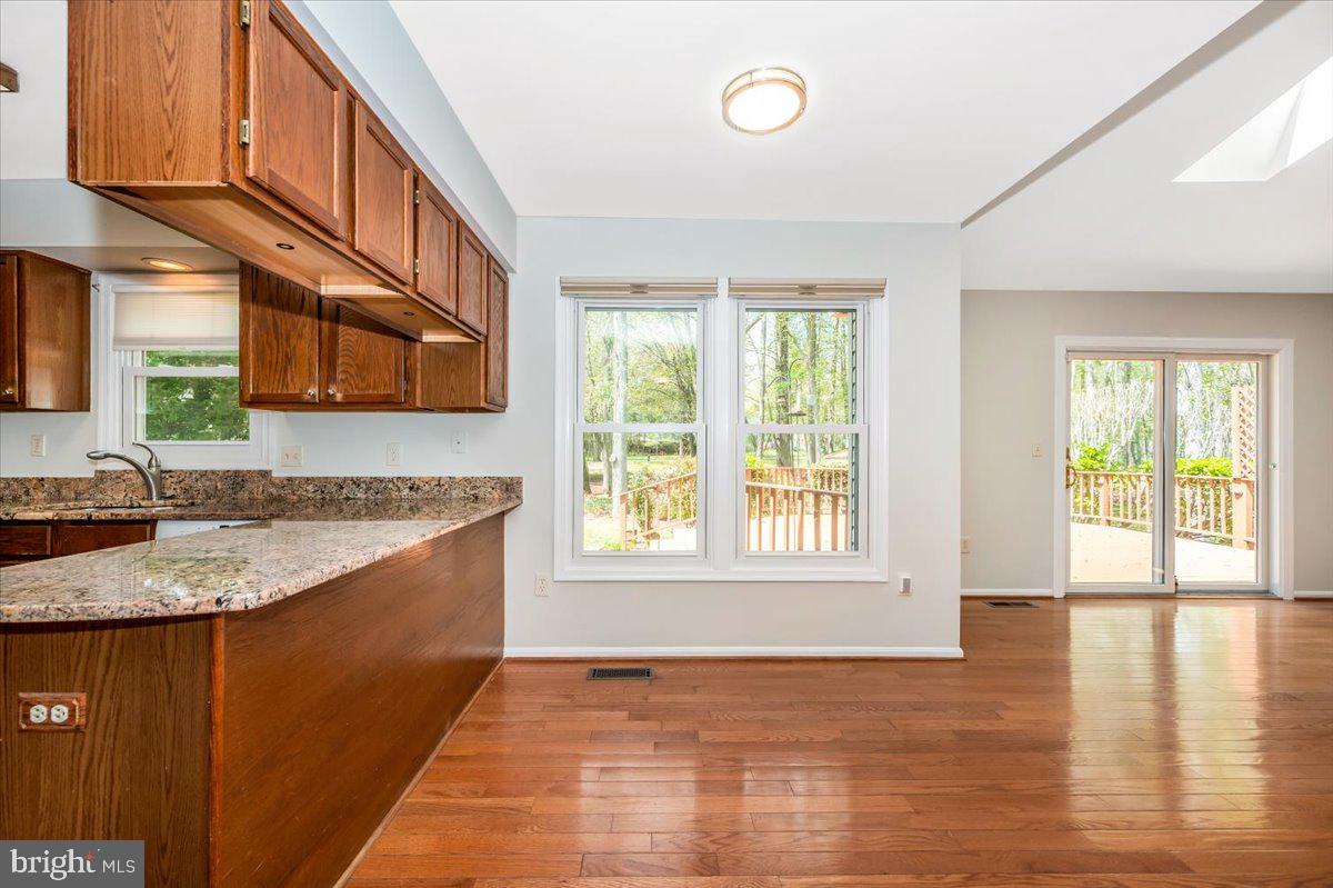 1402 Partridge Lane Bowie, MD 20721 - Photo 17 of 56 a view of a kitchen counter top space and wooden floor