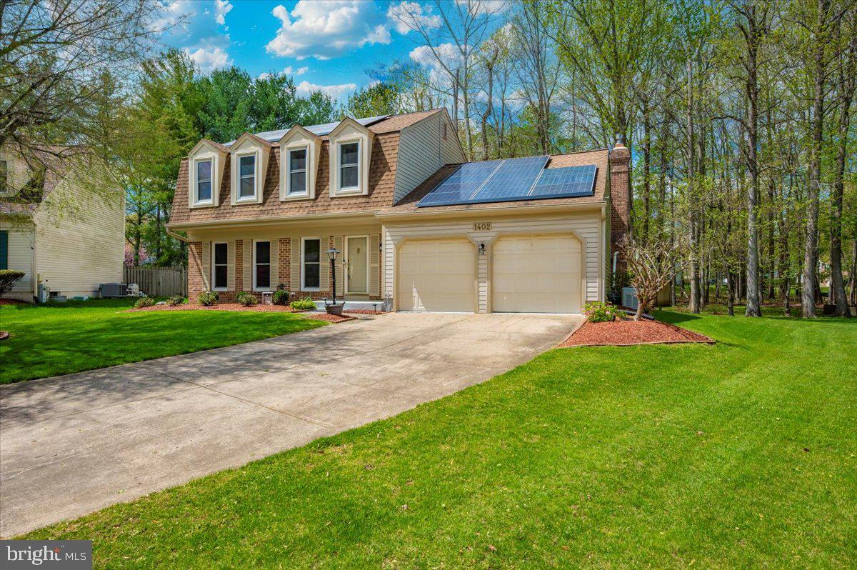 1402 Partridge Lane Bowie, MD 20721 - Photo 2 of 56 a front view of house with yard and green space