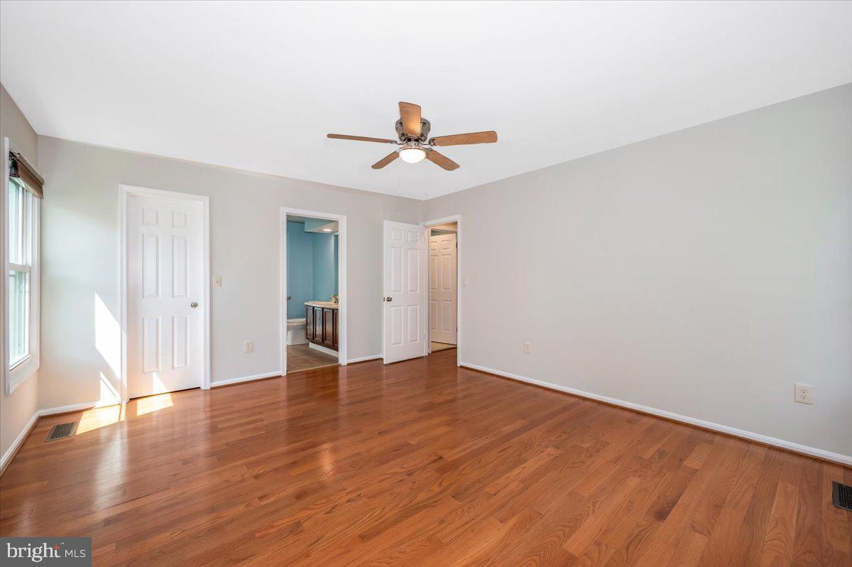 1402 Partridge Lane Bowie, MD 20721 - Photo 30 of 56 wooden floor in an empty room with a window