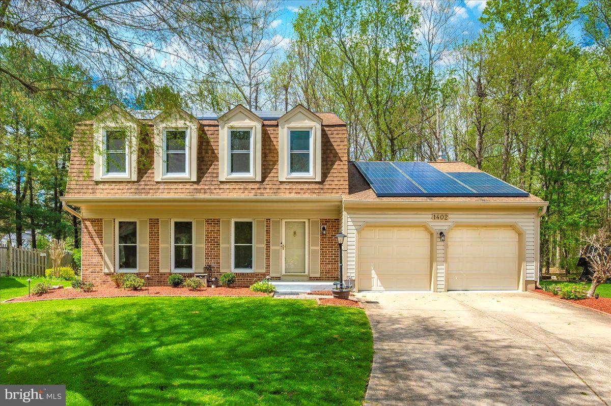 1402 Partridge Lane Bowie, MD 20721 - Photo 3 of 56 front view of a house with a yard
