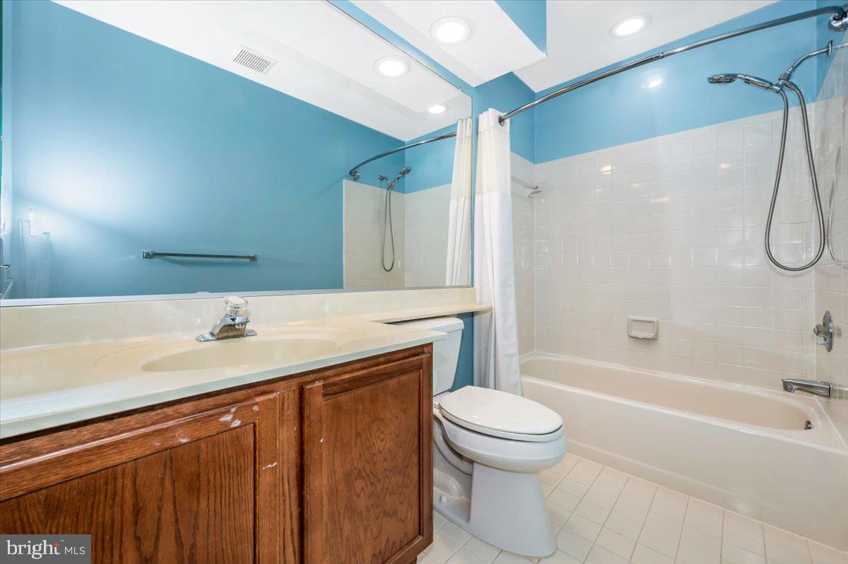 1402 Partridge Lane Bowie, MD 20721 - Photo 32 of 56 a bathroom with a sink a toilet and a bathtub