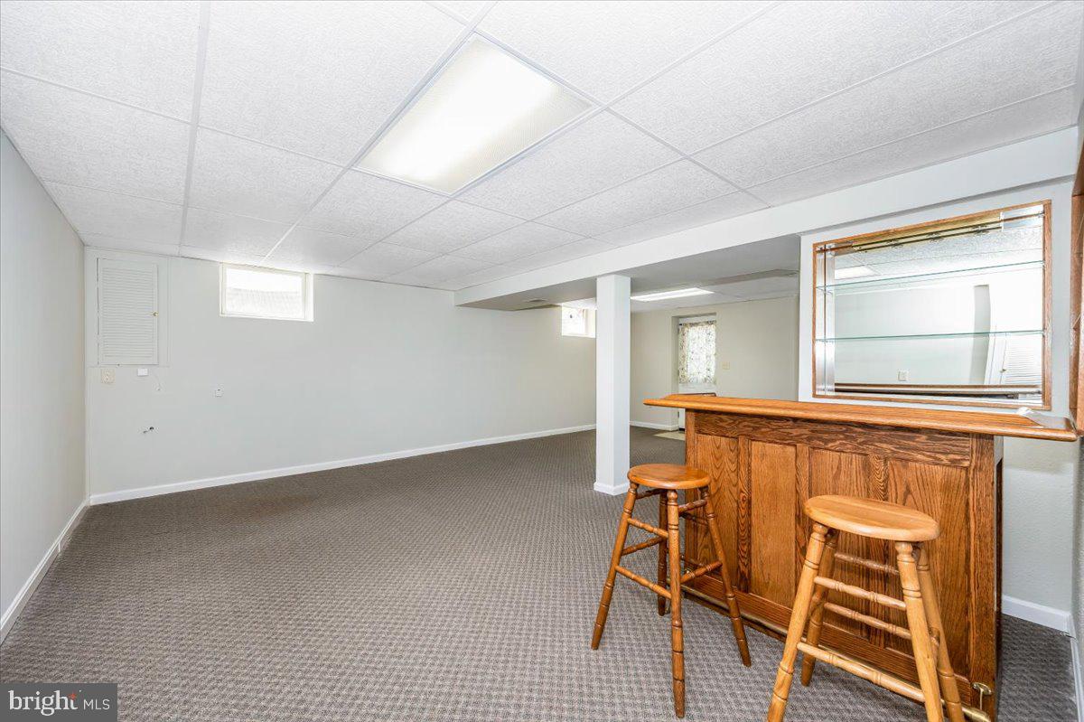 1402 Partridge Lane Bowie, MD 20721 - Photo 38 of 56 an empty room with wooden floor and windows