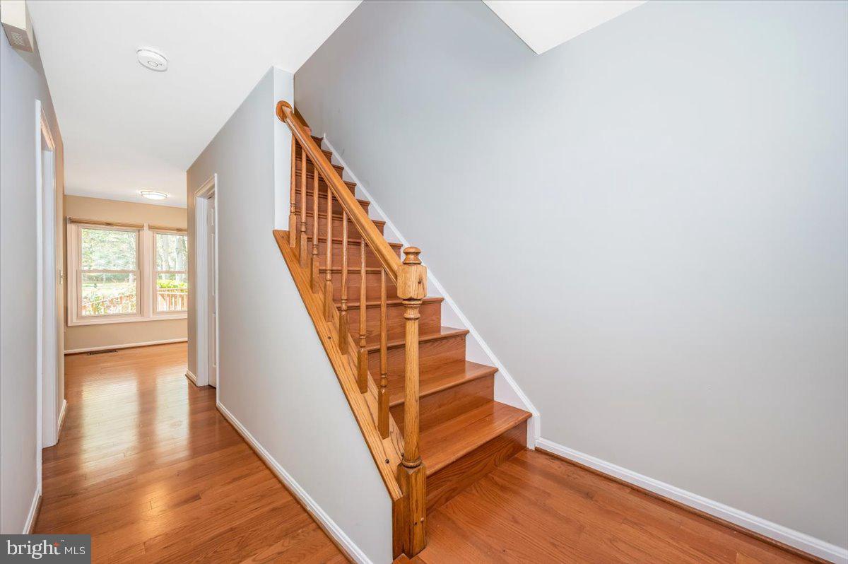 1402 Partridge Lane Bowie, MD 20721 - Photo 5 of 56 a view of entryway and hall with wooden floor
