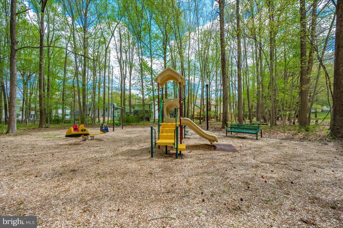 1402 Partridge Lane Bowie, MD 20721 - Photo 54 of 56 a view of a park with swings and slides