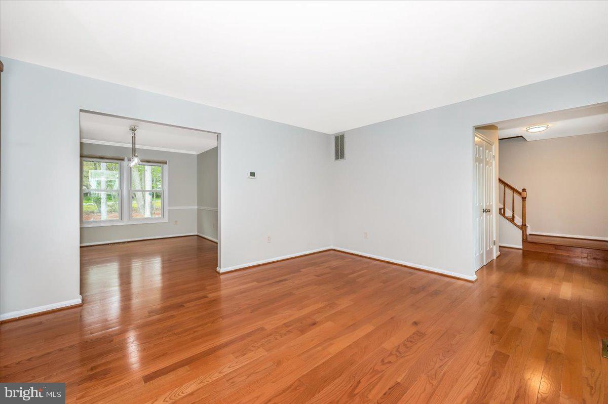 1402 Partridge Lane Bowie, MD 20721 - Photo 8 of 56 an empty room with wooden floor and windows
