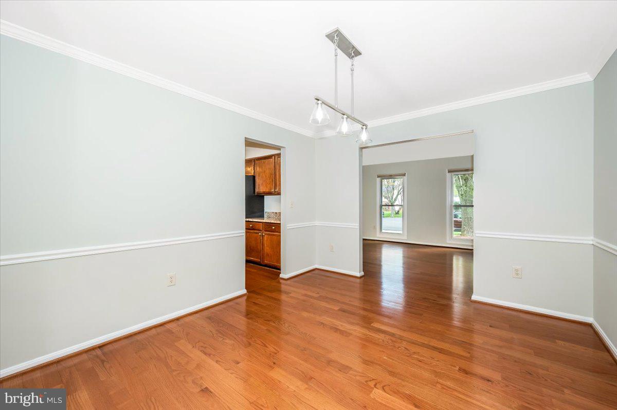 1402 Partridge Lane Bowie, MD 20721 - Photo 10 of 56 wooden floor in an empty room with a window