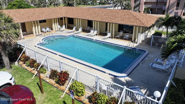 a view of swimming pool with a yard