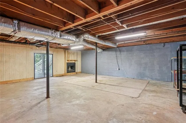 a view of empty room with wooden ceiling