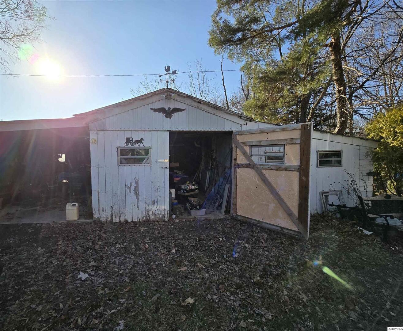 2219 North 1350th Avenue Camp Point, IL 62320 - Photo 6 of 16 a view of a house with a yard