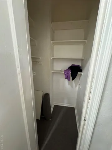 a view of hallway with livingroom