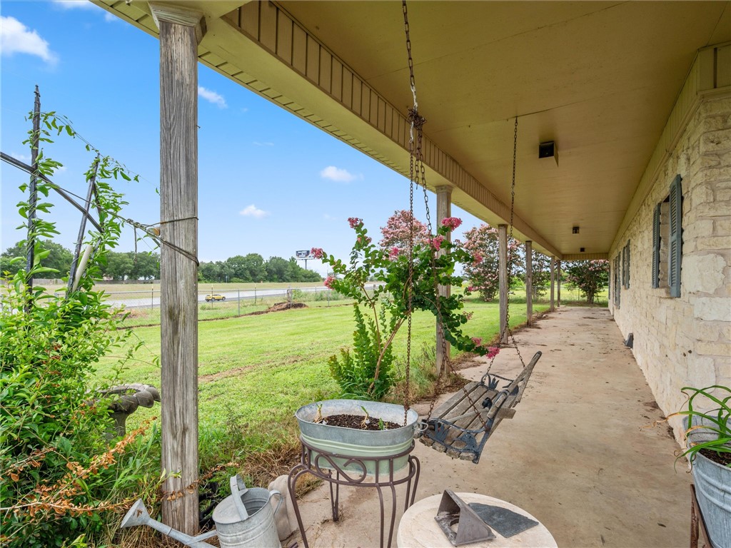 17645 Highway 6 Navasota, TX 77868 - Photo 12 of 30 a view of a chairs and table in backyard