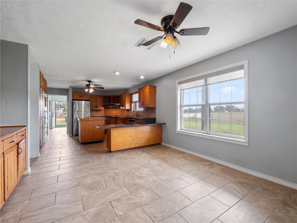 17645 Highway 6 Navasota, TX 77868 - Photo 21 of 30 a living room with furniture and kitchen view