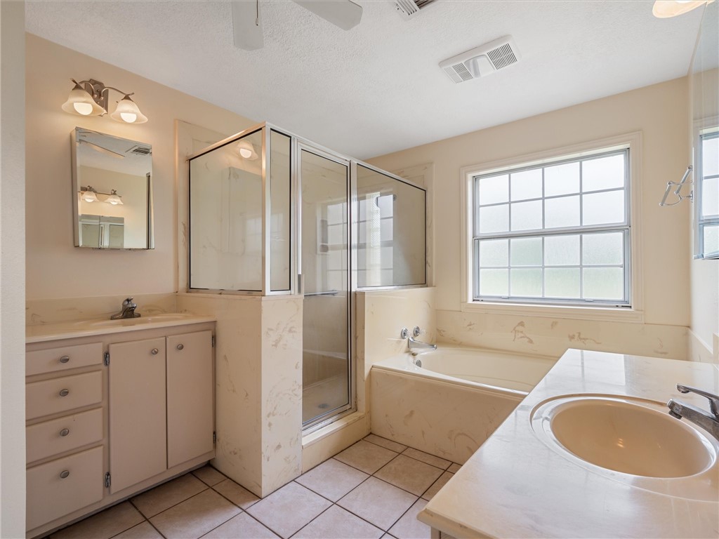 17645 Highway 6 Navasota, TX 77868 - Photo 23 of 30 a spacious bathroom with a tub sink and mirror