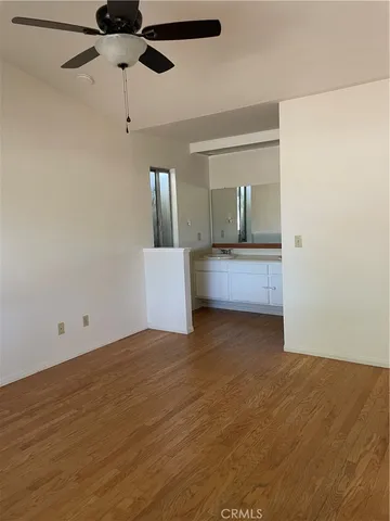 a view of a kitchen with a sink and cabinets