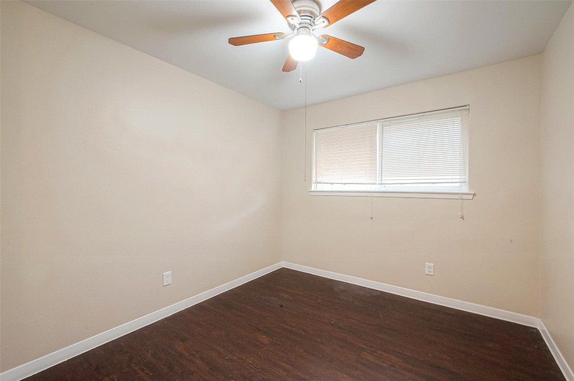 1447 Willow Rock Road Houston, TX 77088 - Photo 21 of 37 an empty room with wooden floor and windows
