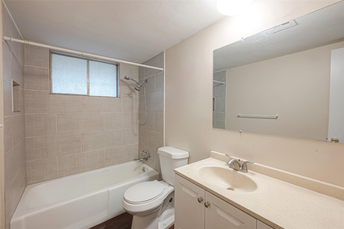 1447 Willow Rock Road Houston, TX 77088 - Photo 29 of 37 a bathroom with a sink toilet and shower