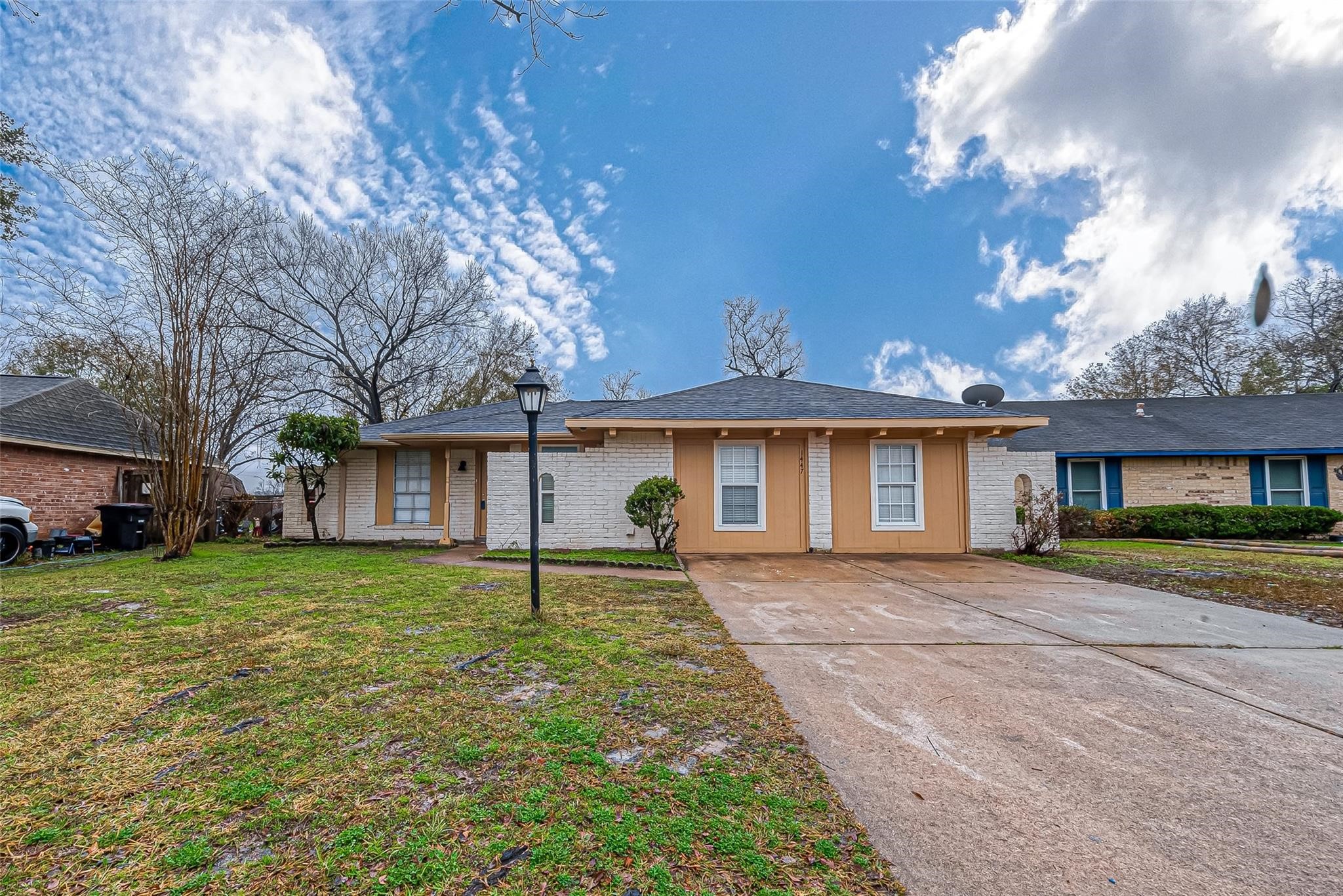 1447 Willow Rock Road Houston, TX 77088 - Photo 3 of 37 a front view of a house with a yard