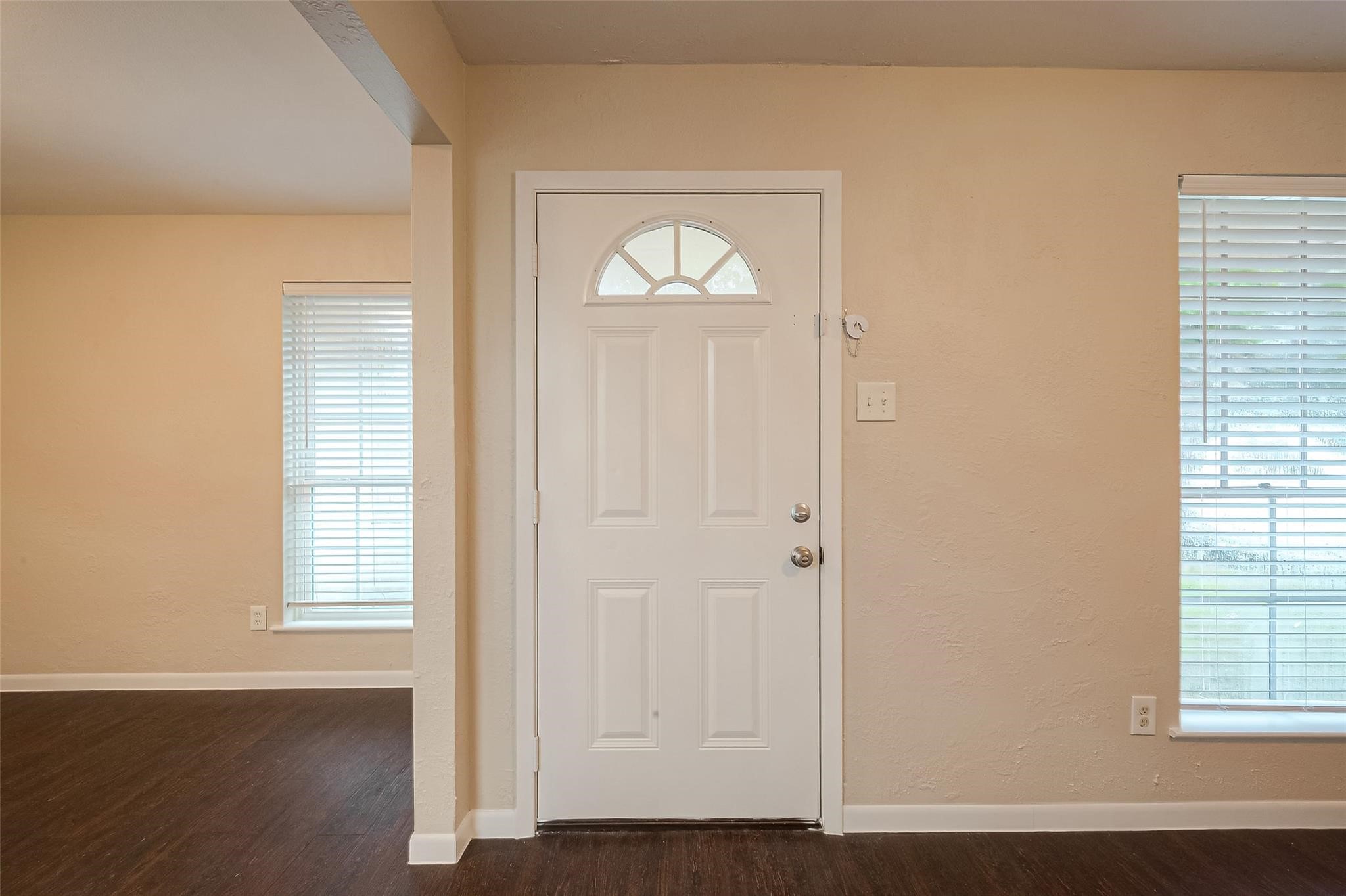 1447 Willow Rock Road Houston, TX 77088 - Photo 4 of 37 an empty room with wooden floor and windows
