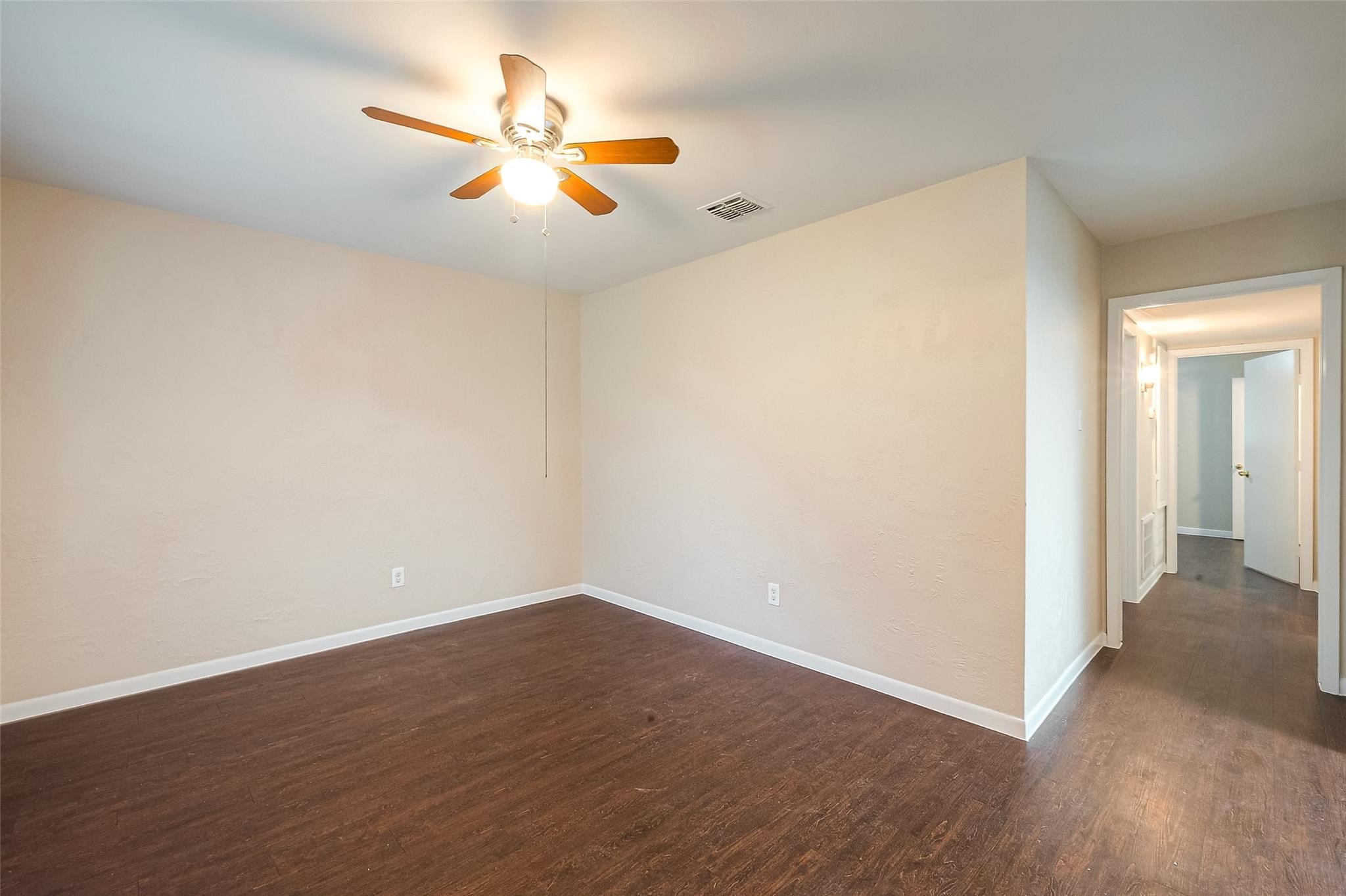 1447 Willow Rock Road Houston, TX 77088 - Photo 5 of 37 a view of an empty room with wooden floor
