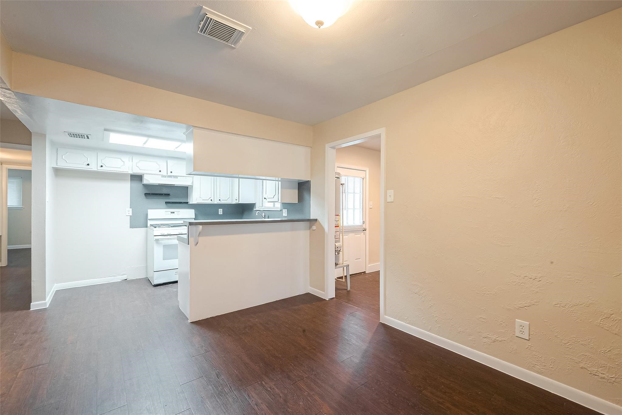 1447 Willow Rock Road Houston, TX 77088 - Photo 10 of 37 a view of kitchen with wooden floor