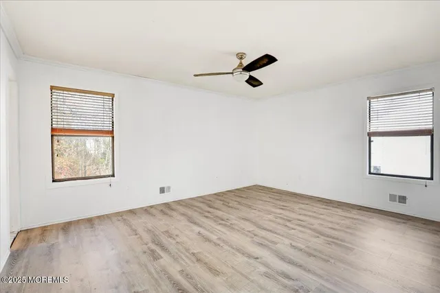 a bathroom with a sink vanity mirror and toilet