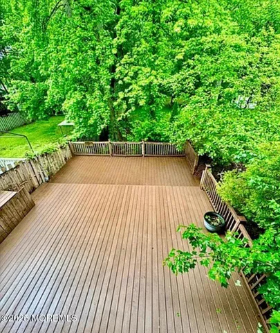 a view of a house with wooden deck