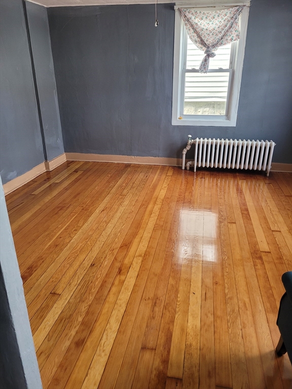 90 Tremont Street Fall River, MA 02720 - Photo 16 of 16 a view of wooden floor in a room