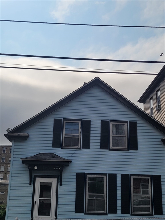 90 Tremont Street Fall River, MA 02720 - Photo 6 of 16 a front view of a house with garage