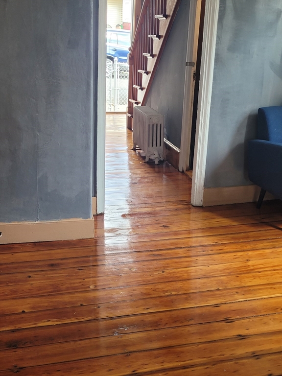 90 Tremont Street Fall River, MA 02720 - Photo 9 of 16 a view of a room with wooden floor and staircase