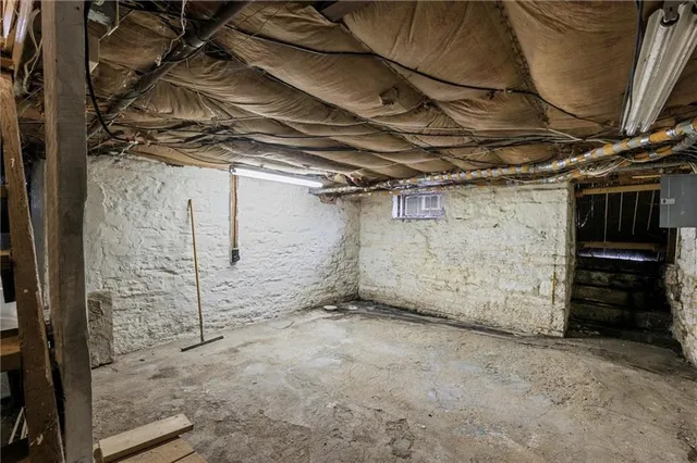 a view of a house with a garage and yard