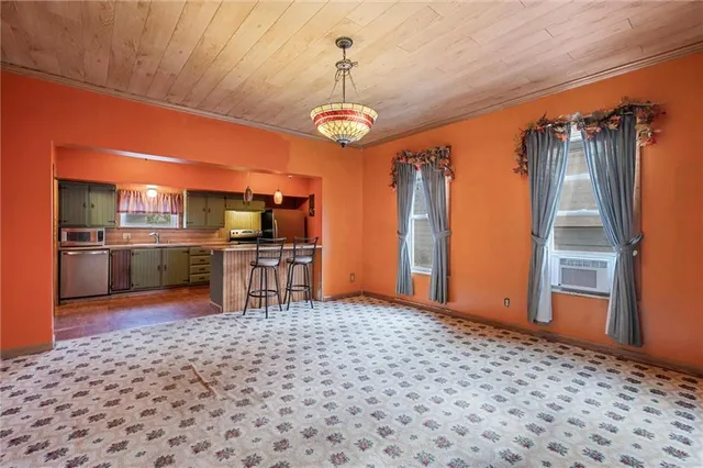 a view of a kitchen with a stove cabinets and a kitchen