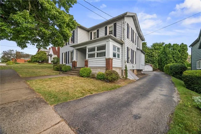 a view of a house with a garage