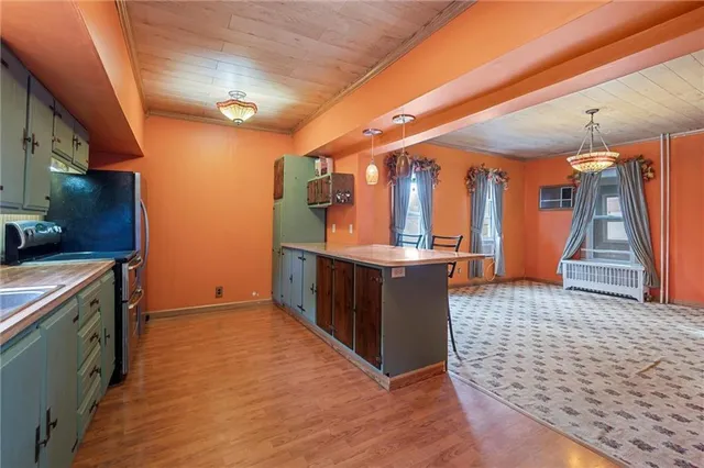 a view of a kitchen with furniture and a kitchen
