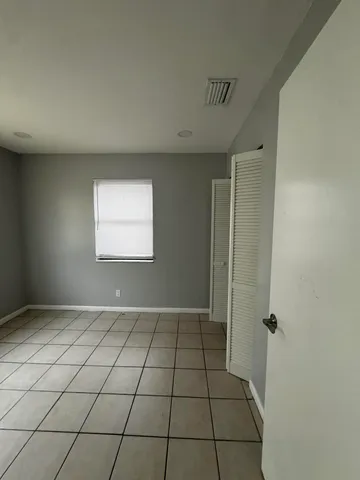 a view of an empty room and window