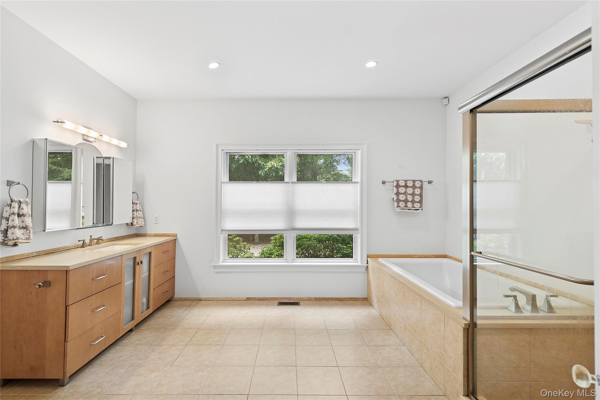 3470 North Bayview Road Southold, NY 11971 - Photo 7 of 25 Primary Bathroom with vanity, a bath, light tile patterned floors, recessed lighting, and a shower stall