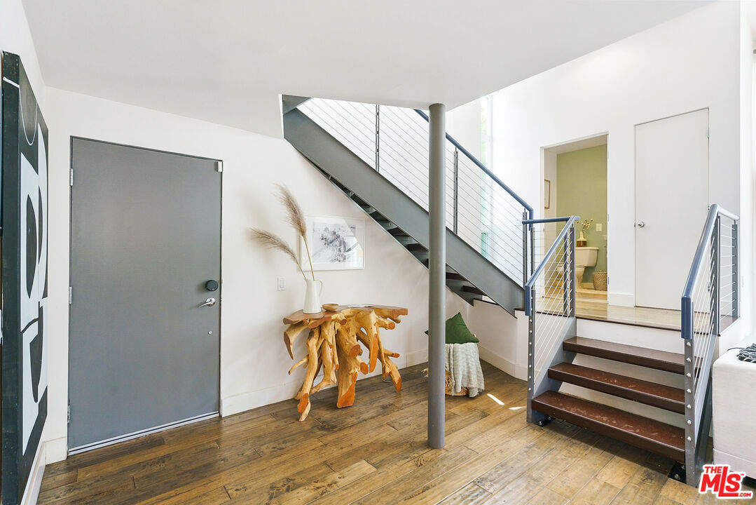 1228 21st Street, Unit D Santa Monica, CA 90404 - Photo 13 of 32 a view of entryway with wooden floor and stairs