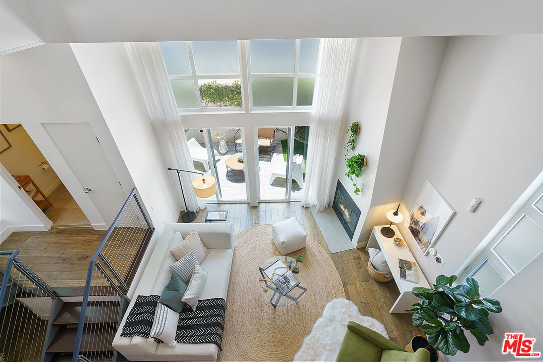 1228 21st Street, Unit D Santa Monica, CA 90404 - Photo 14 of 32 a living room with furniture and a table