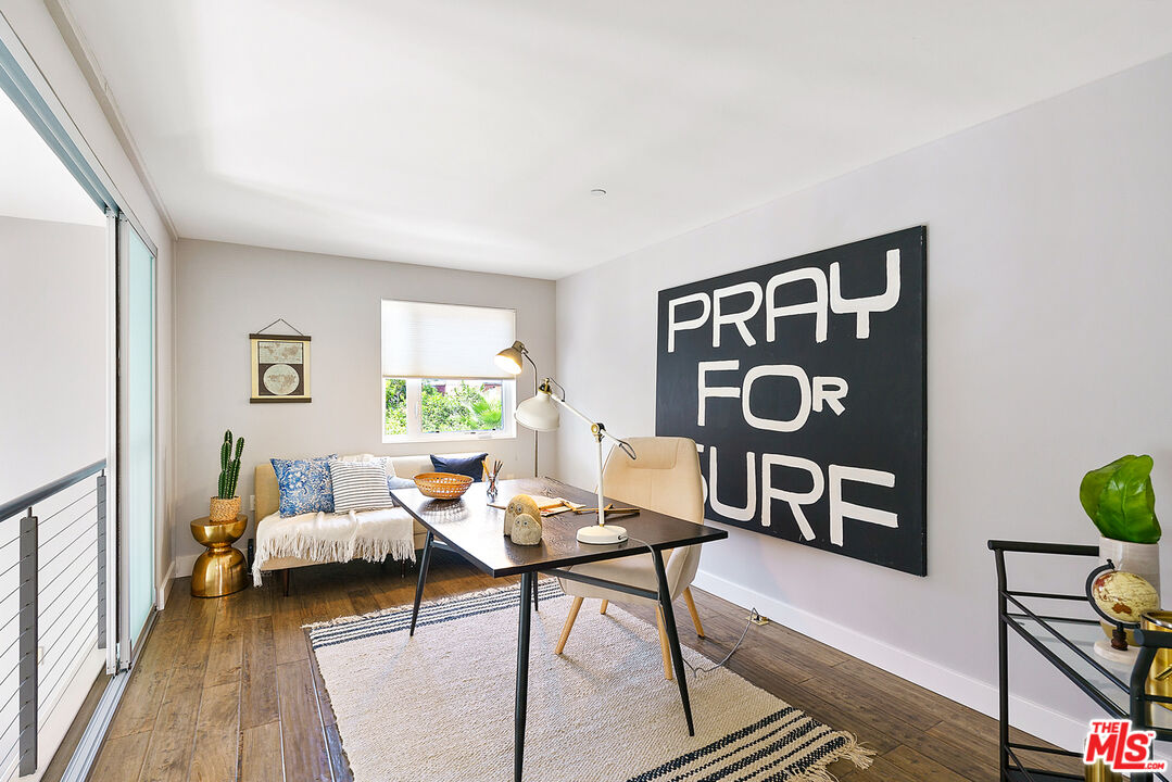 1228 21st Street, Unit D Santa Monica, CA 90404 - Photo 15 of 32 a living room with furniture and wooden floor