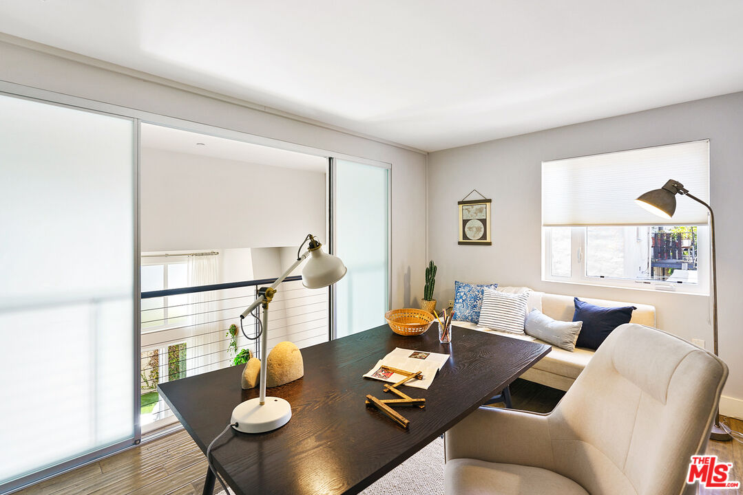 1228 21st Street, Unit D Santa Monica, CA 90404 - Photo 17 of 32 a living room with furniture and a window