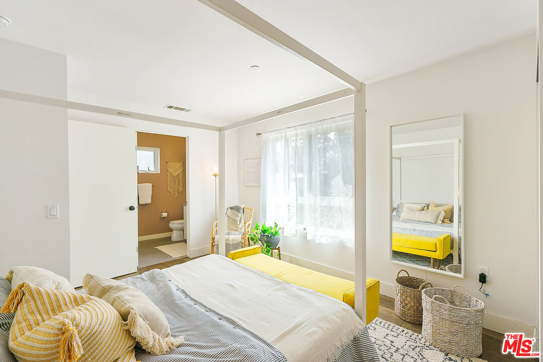 1228 21st Street, Unit D Santa Monica, CA 90404 - Photo 20 of 32 a bedroom with a bed and a window