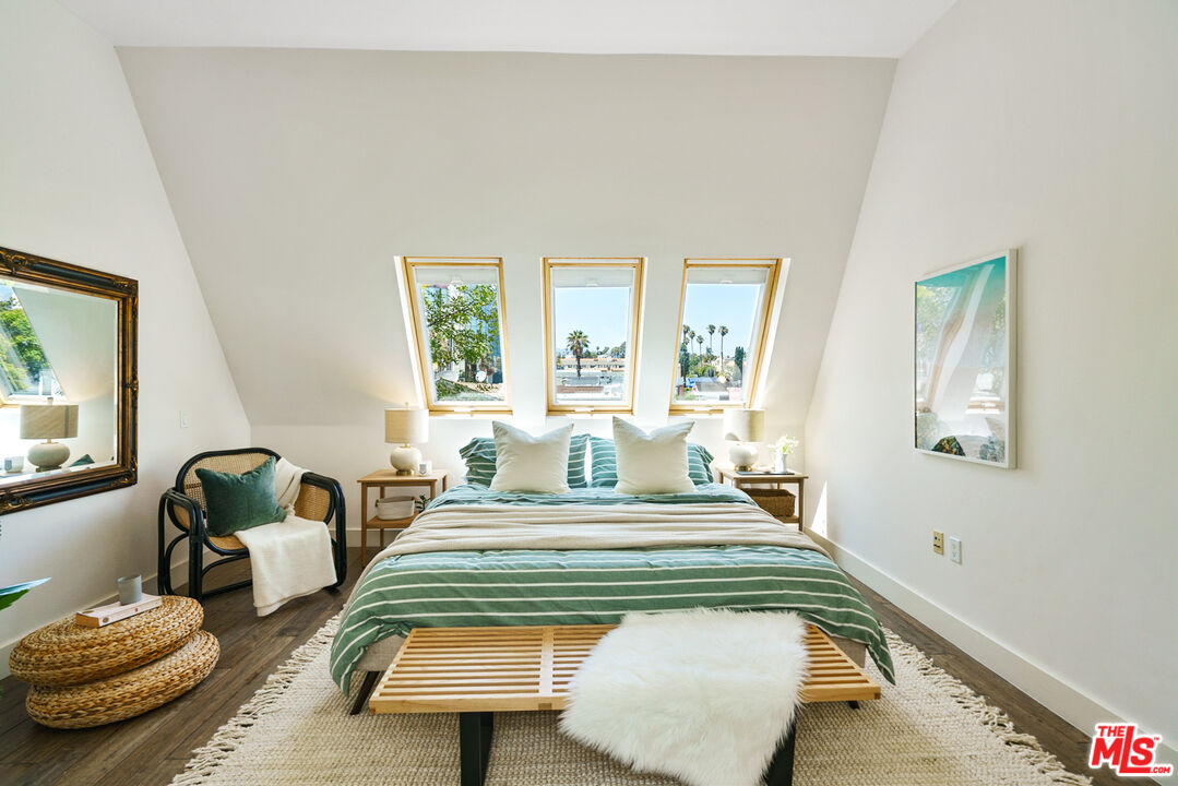 1228 21st Street, Unit D Santa Monica, CA 90404 - Photo 24 of 32 a bedroom with a bed window and couch