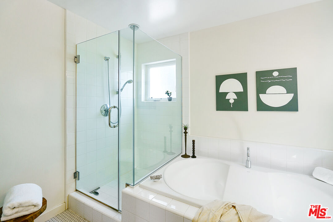 1228 21st Street, Unit D Santa Monica, CA 90404 - Photo 28 of 32 a bathroom with a granite countertop sink toilet and shower