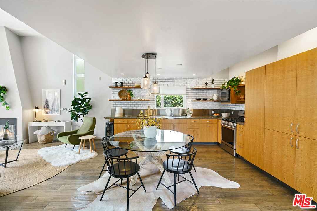 1228 21st Street, Unit D Santa Monica, CA 90404 - Photo 6 of 32 a view of a dining room with furniture window and wooden floor