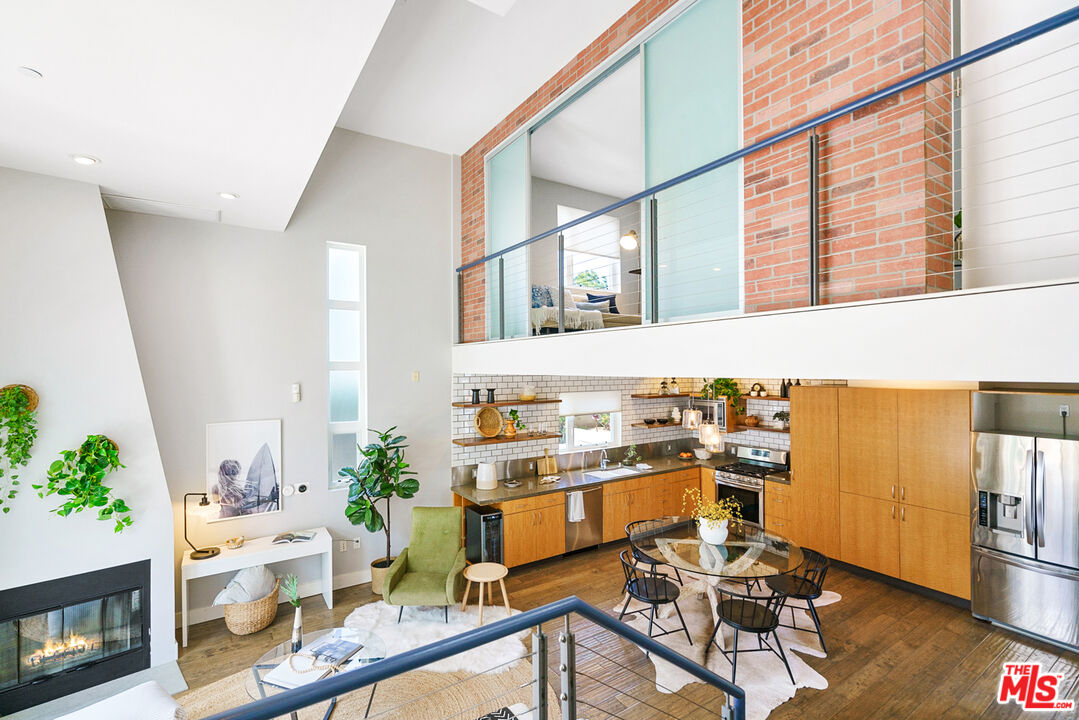1228 21st Street, Unit D Santa Monica, CA 90404 - Photo 8 of 32 a view of a workspace with furniture and a potted plant