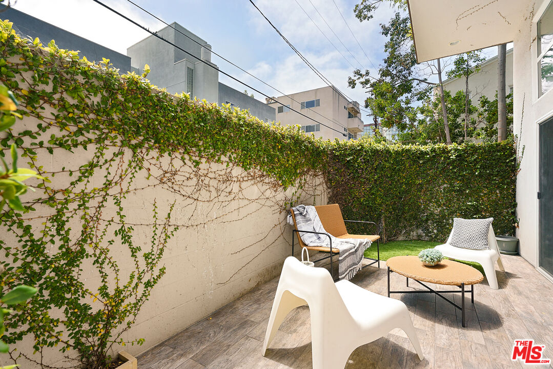 1228 21st Street, Unit D Santa Monica, CA 90404 - Photo 9 of 32 a view of a patio with couple of chairs