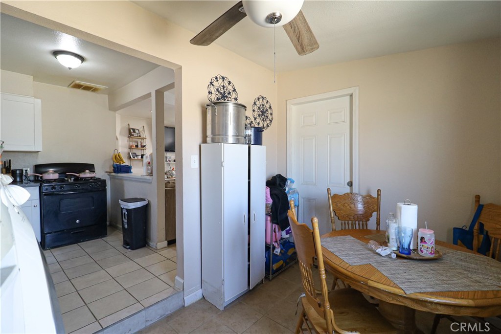 25466 Jasper Road Barstow, CA 92311 - Photo 16 of 32 a kitchen with a sink cabinets and appliances