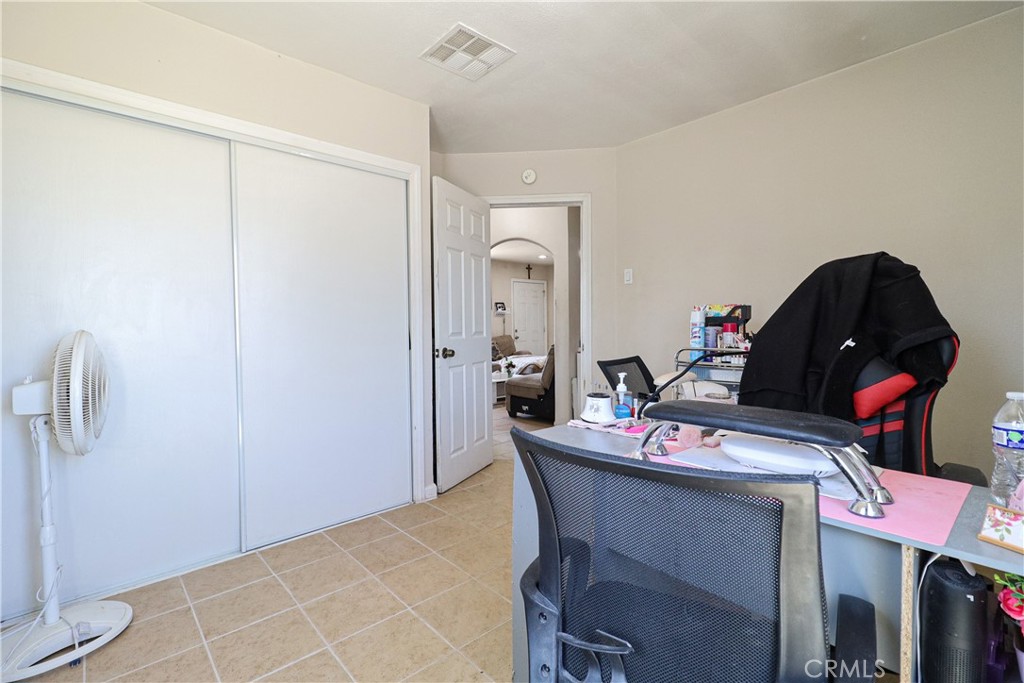 25466 Jasper Road Barstow, CA 92311 - Photo 23 of 32 a view of a dining room with furniture and a chandelier