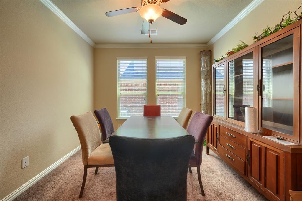 12417 Hitch Rack Way McKinney, TX 75071 - Photo 3 of 17 Dining space featuring ceiling fan, crown molding, and light carpet