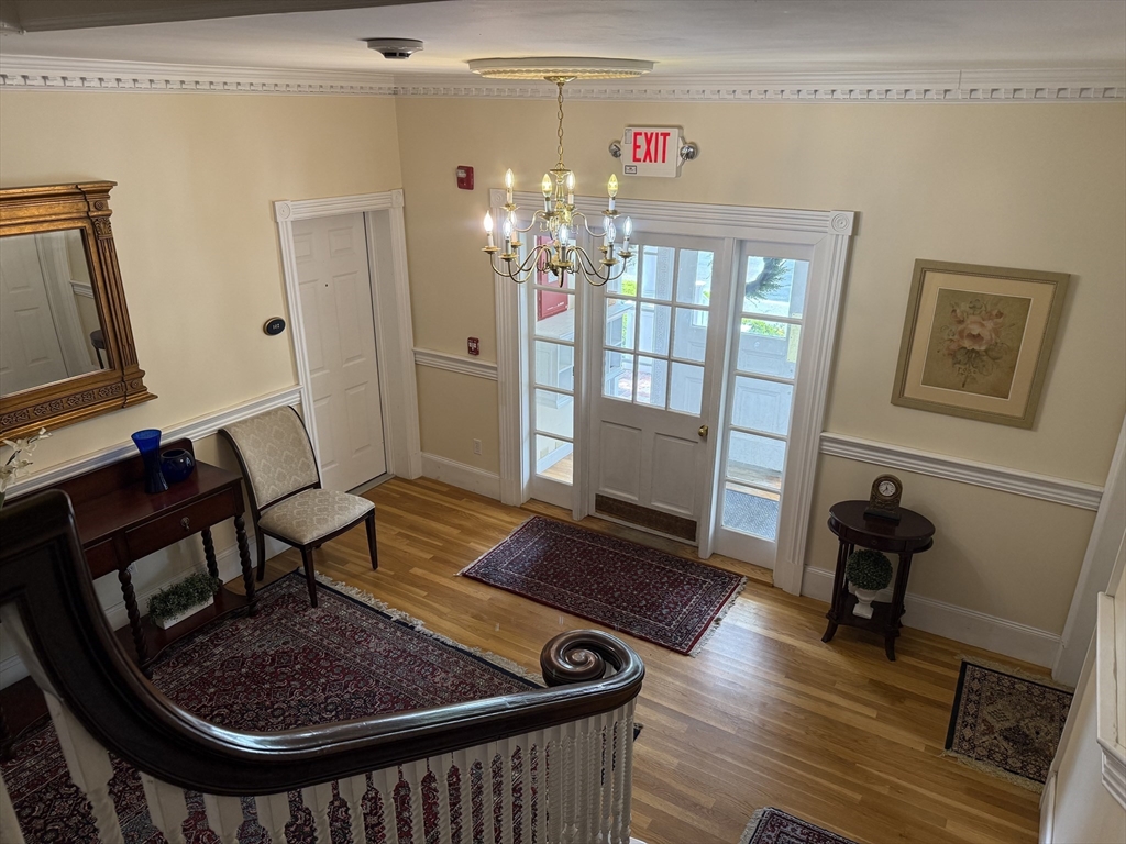 5 Porter Road, Unit 202 Andover, MA 01810 - Photo 16 of 17 a view of a livingroom with furniture and hardwood floor